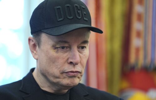 Elon Musk attends a news conference with President Donald Trump in the Oval Office of the White House
