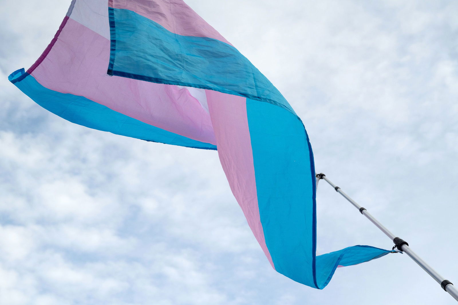<i>Stephanie Keith/Bloomberg/Getty Images/File via CNN Newsource</i><br/>A transgender pride flag is waved during a rally against President Donald Trump's executive actions targeting transgender people