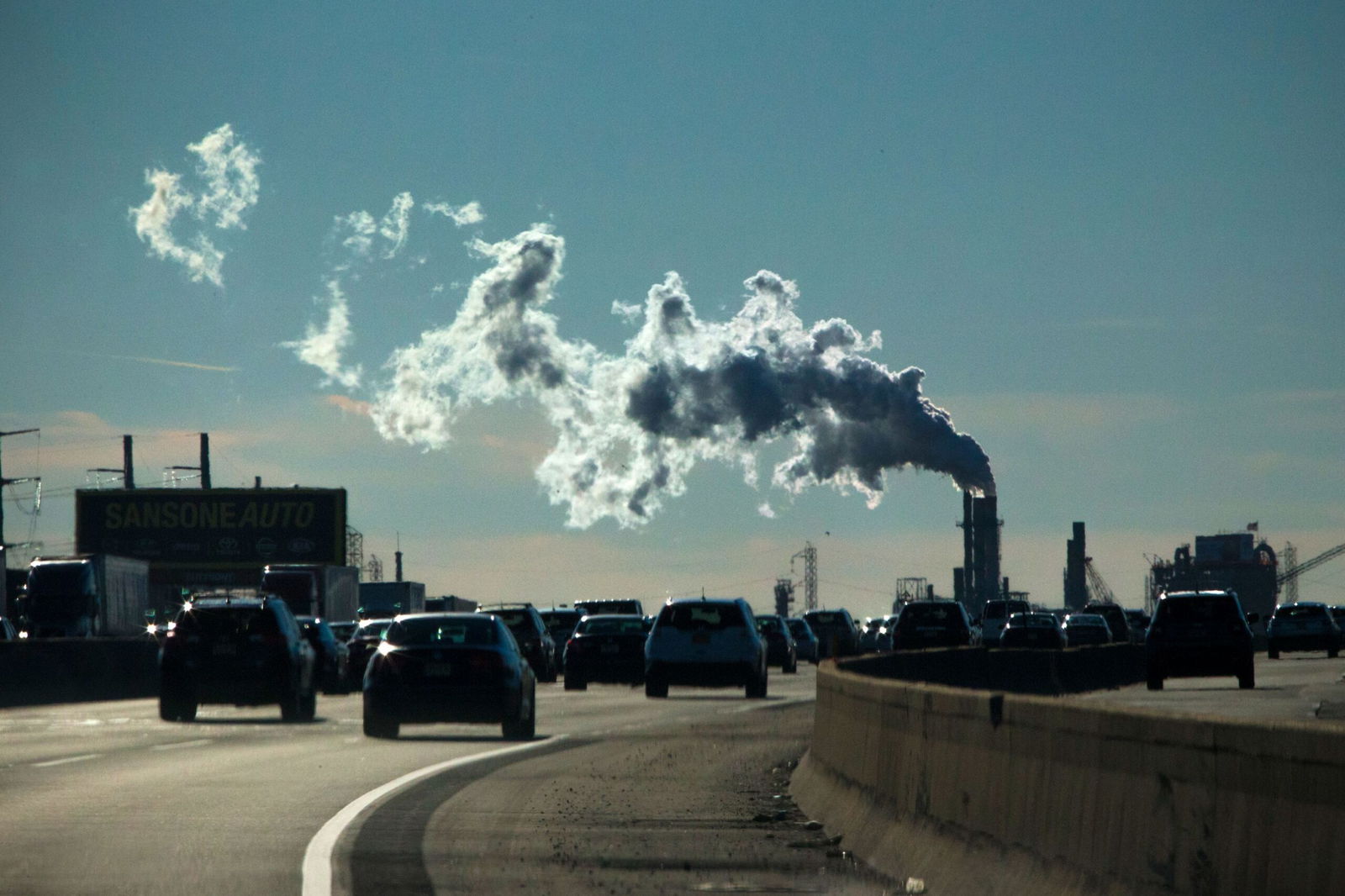 <i>Kena Betancur/VIEWpress/Corbis/Getty Images via CNN Newsource</i><br/>Vehicles move along the The New Jersey Turnpike Way while a Factory emits smoke on November 17