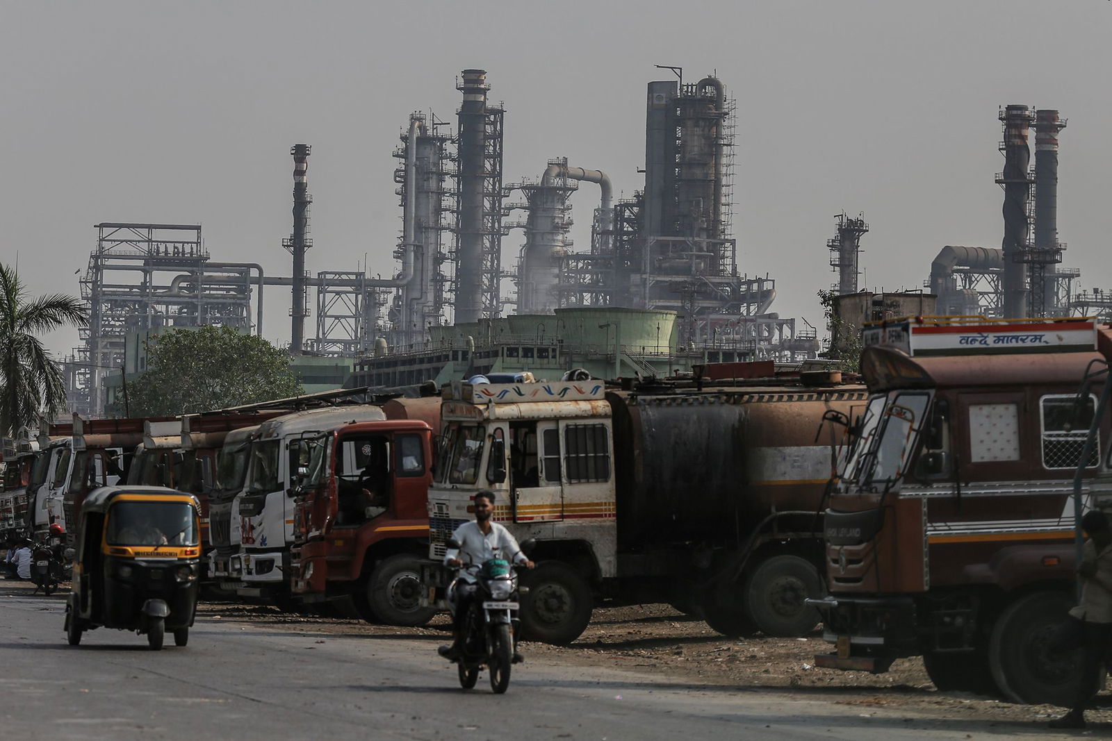 <i>Dhiraj Singh/Bloomberg/Getty Images via CNN Newsource</i><br/>Oil tanker trucks are pictured outside an oil refinery operated by Bharat Petroleum Corp. Ltd.
