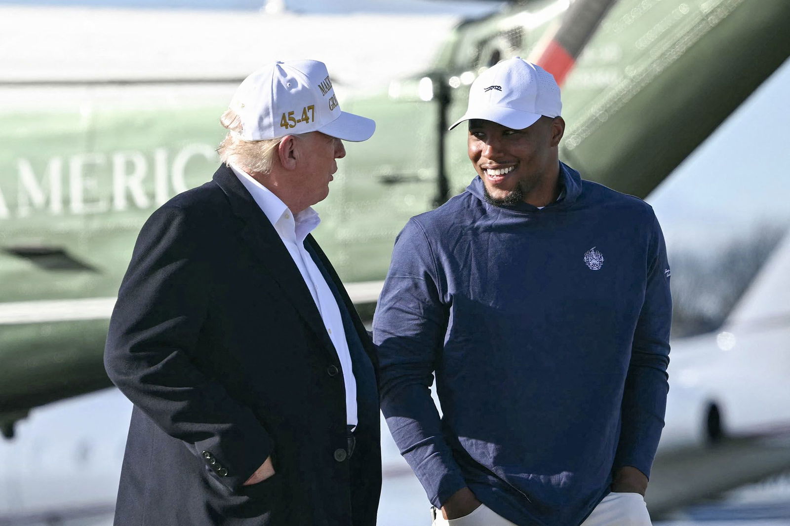 <i>Mandel Ngan/AFP/Getty Images via CNN Newsource</i><br/>President Donald Trump walks with Philadelphia Eagles running back Saquon Barkley before boarding Air Force One on April 27. Barkley said on August 4 that he was surprised to learn he had been named to the President’s Council on Sports