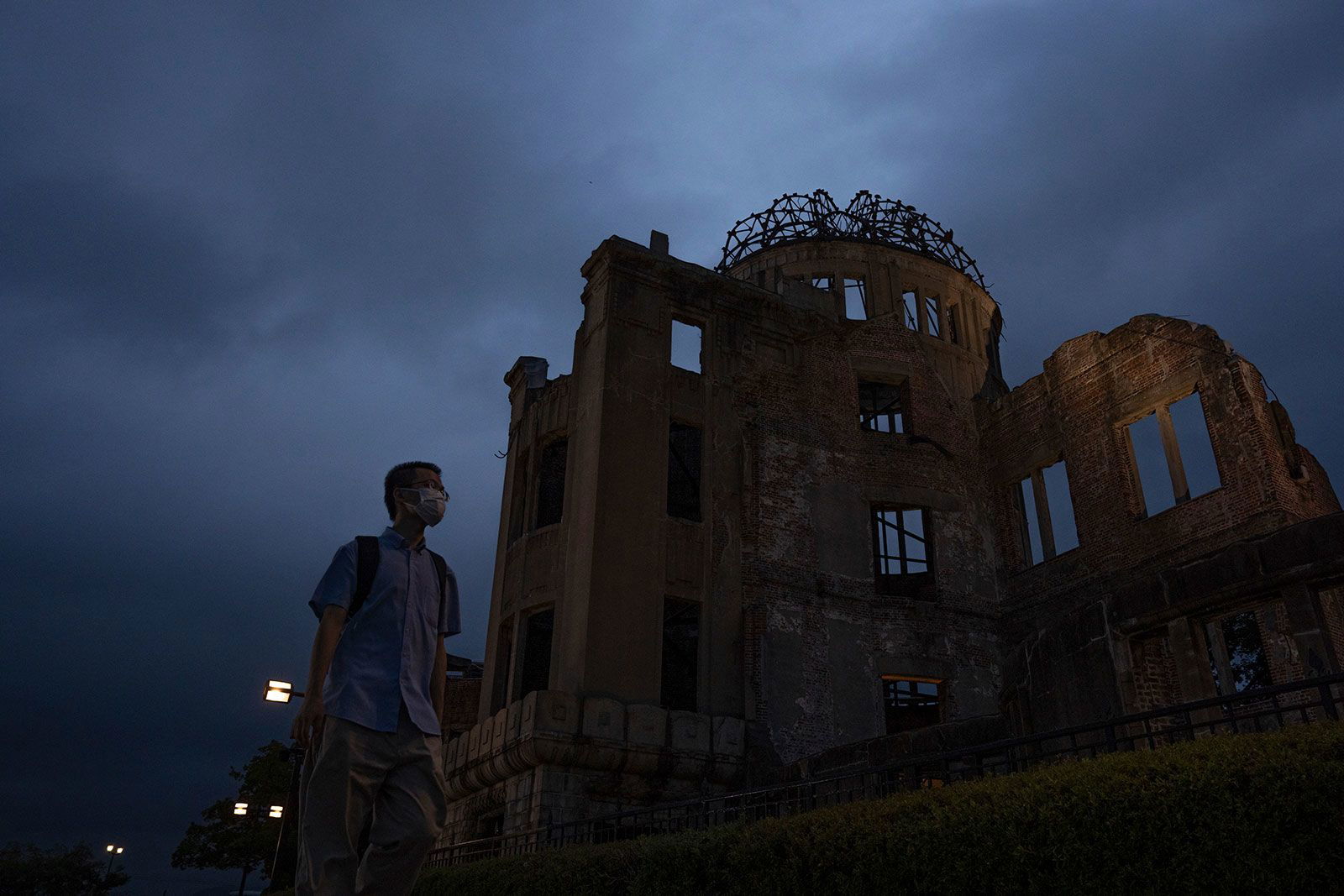 <i>Louise Delmotte/AP via CNN Newsource</i><br/>A visitor walks past the Atomic Bomb Dome in Hiroshima