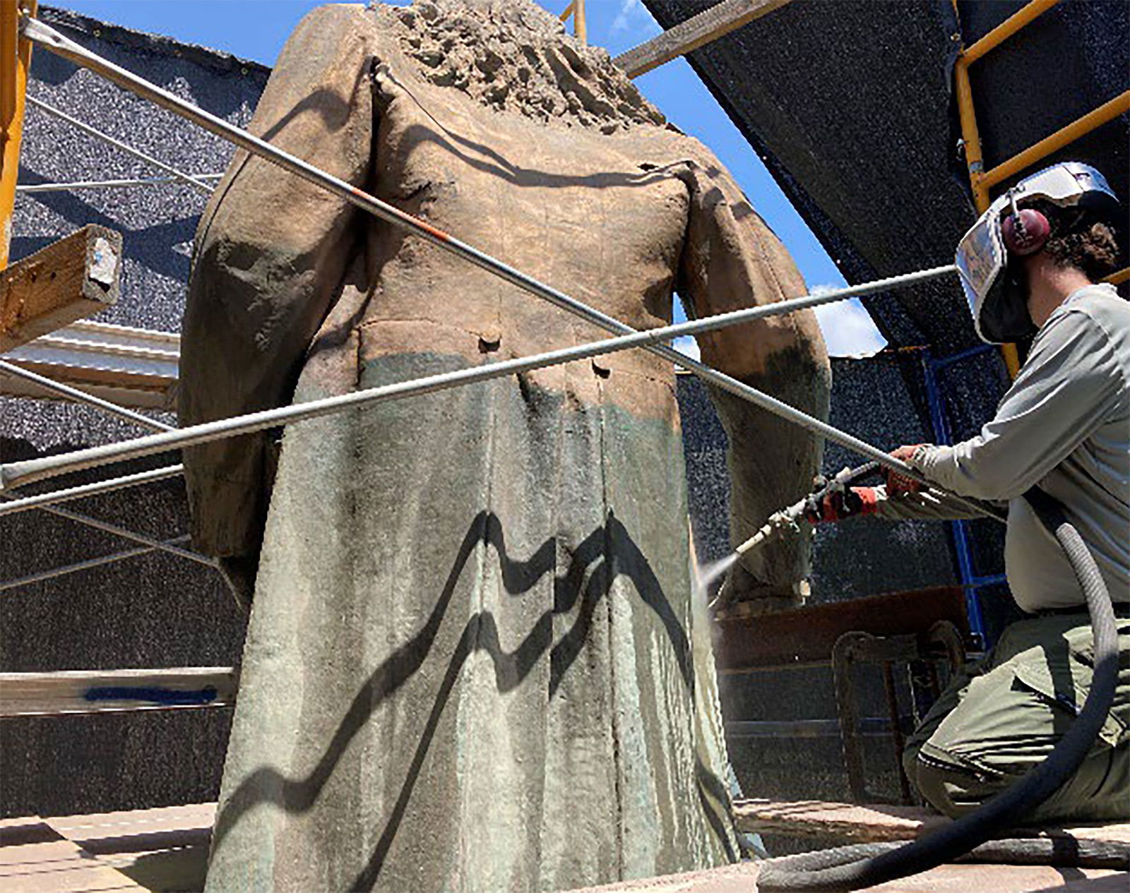 <i>National Park Service via CNN Newsource</i><br/>Micro-abrasive cleaning of the Albert Pike statue to remove corrosion and paint in order to review the conditions of the bronze prior to repairs