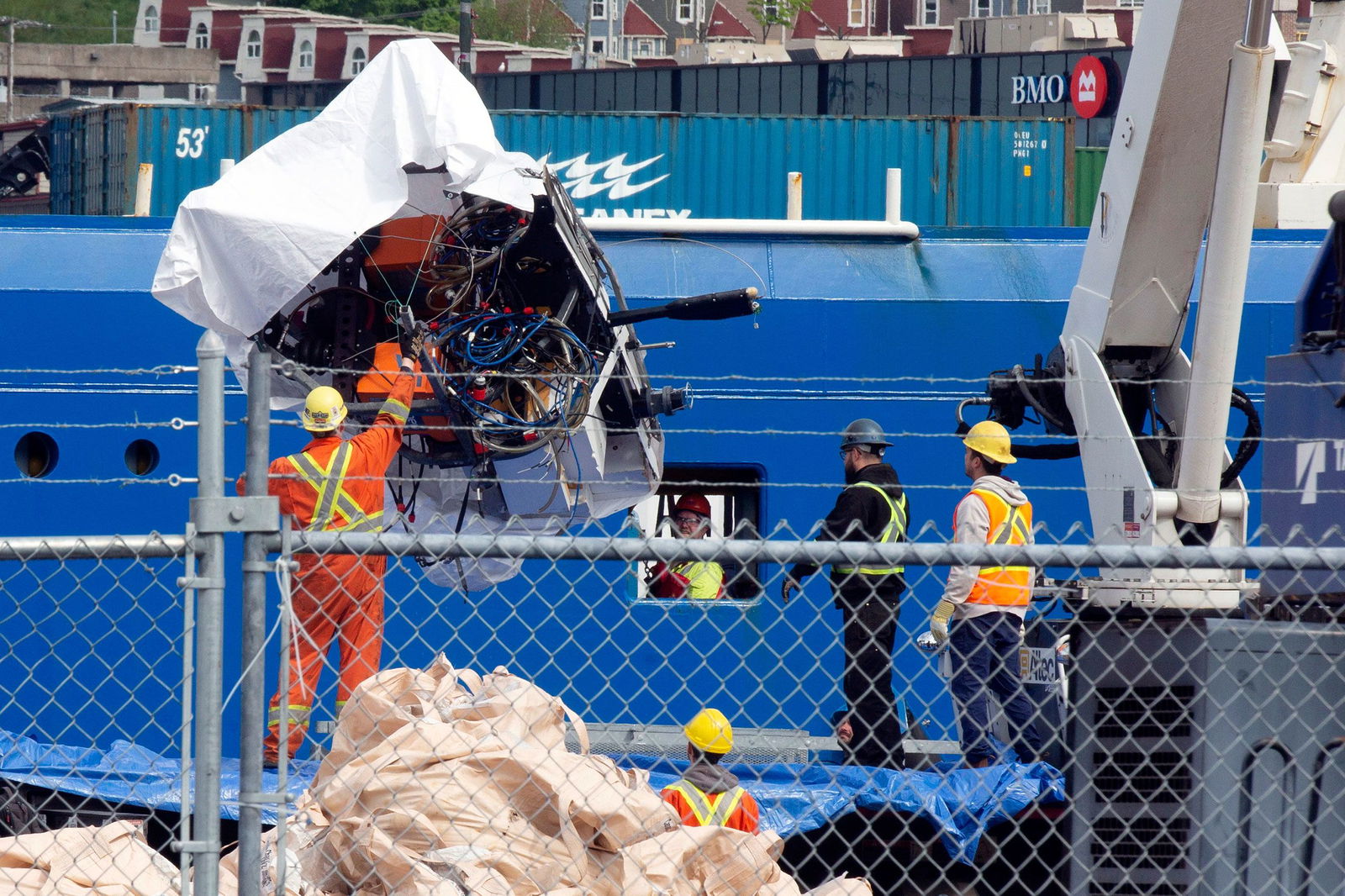<i>Paul Daly/The Canadian Press/AP via CNN Newsource</i><br/>Debris from the Titan submersible is unloaded at the Canadian Coast Guard pier in St. John's