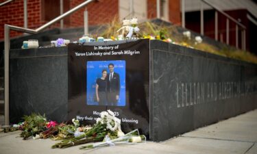 A photograph of Sarah Lynn Milgrim and Yaron Lischinsky is displayed outside the Lillian and Albert Small Capital Jewish Museum in Washington