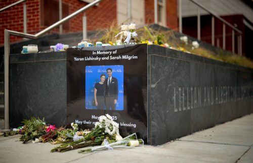 A photograph of Sarah Lynn Milgrim and Yaron Lischinsky is displayed outside the Lillian and Albert Small Capital Jewish Museum in Washington