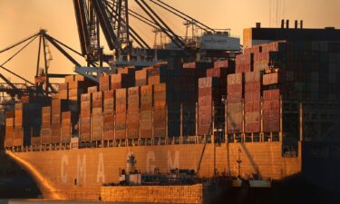 A cargo ship is unloaded at Port Liberty in New Jersey. President Donald Trump's tariffs have brought in record levels of revenue.