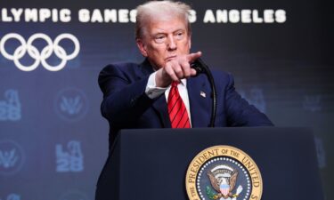 President Donald Trump takes questions from reporters after signing an executive order to create a White House task force to help coordinate logistical issues related to the 2028 Summer Olympic Games.