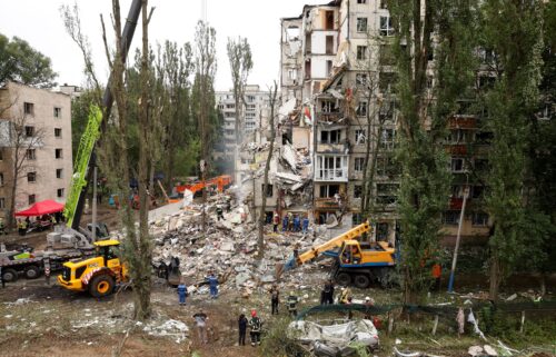 Rescue workers carry out a search and rescue operation at a destroyed residential building struck in a Russian drone-and-missile attack on July 31 in Kyiv