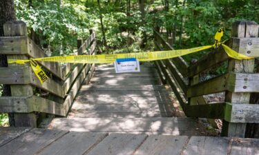 An Arkansas Park Ranger patrols the south entrance of Devil's Den State Park Monday