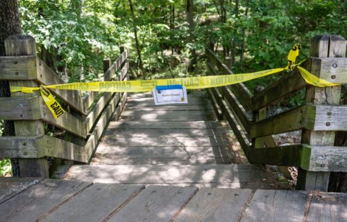 An Arkansas Park Ranger patrols the south entrance of Devil's Den State Park Monday