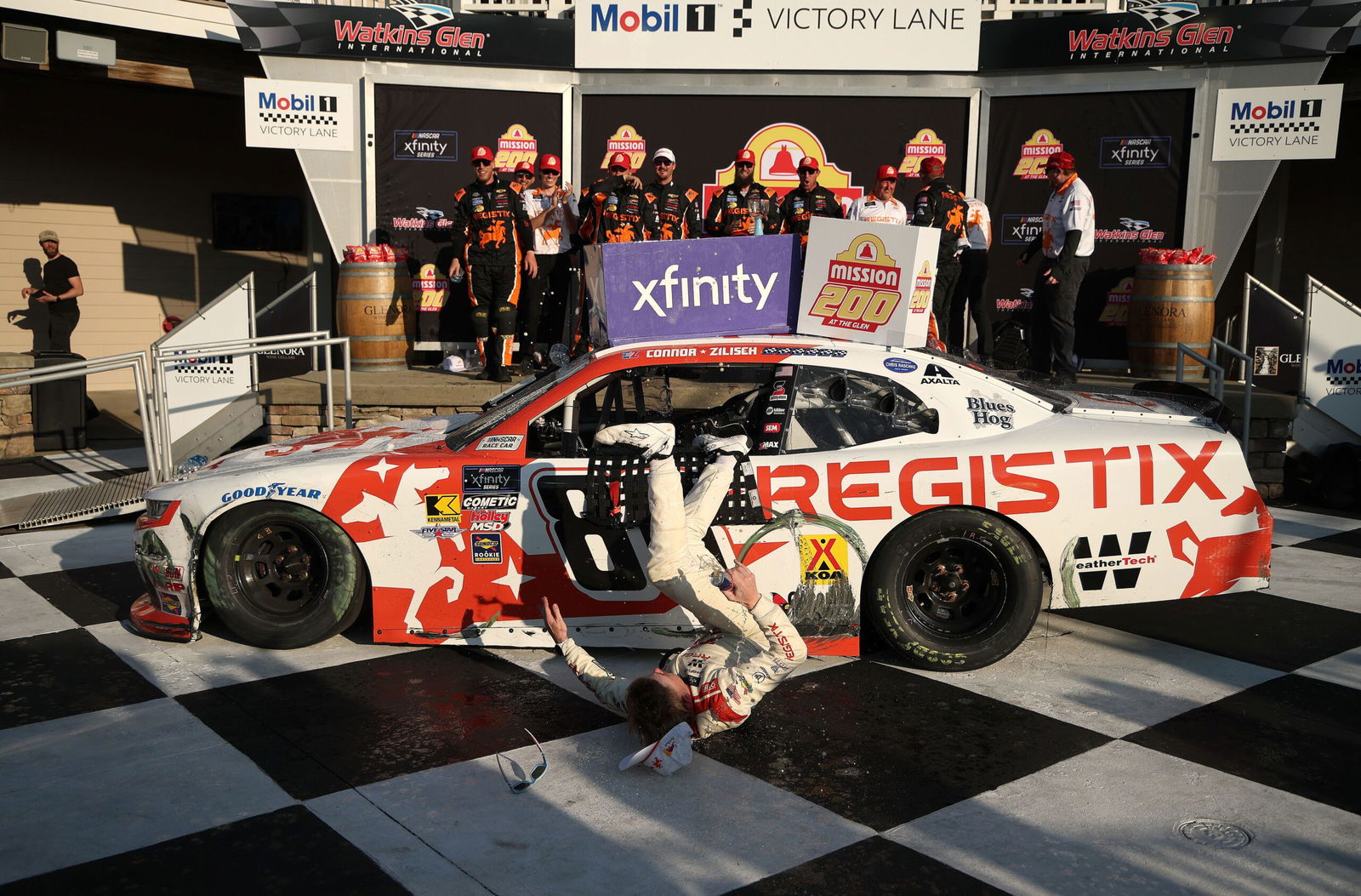 <i>Chris Graythen/Getty Images via CNN Newsource</i><br/>Connor Zilisch slips and falls off his car after winning the NASCAR Xfinity Series' latest race.