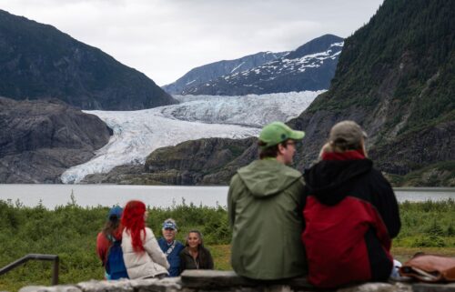 People view Mendenhall Glacier from the Mendenhall Glacier Visitors Center area