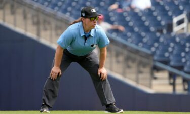 Umpire Jen Pawol takes her position during the first inning of a 2024 spring training game between the St. Louis Cardinals and Washington Nationals. Pawol will make history this week as the first woman to work as an umpire in a Major League Baseball regular season game.