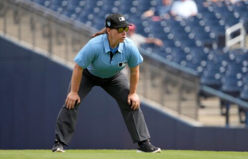 Umpire Jen Pawol takes her position during the first inning of a 2024 spring training game between the St. Louis Cardinals and Washington Nationals. Pawol will make history this week as the first woman to work as an umpire in a Major League Baseball regular season game.