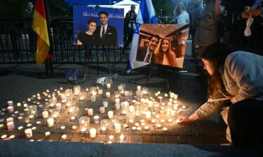 People attend a candlelight vigil at Lafayette Square across from the White House in Washington