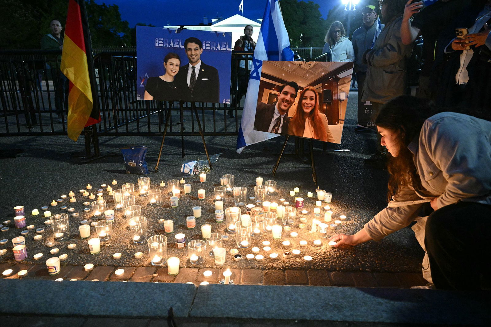<i>Mandel Ngan/AFP/Getty Images via CNN Newsource</i><br/>People attend a candlelight vigil at Lafayette Square across from the White House in Washington