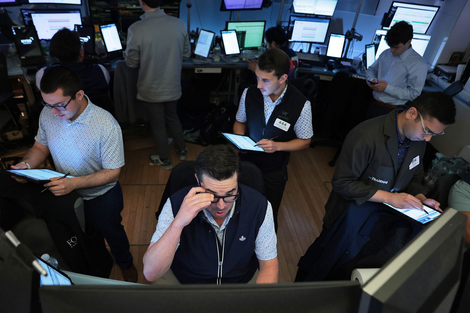 <i>Michael M. Santiago/Getty Images via CNN Newsource</i><br/>Traders work on the floor of the New York Stock Exchange during afternoon trading on August 1