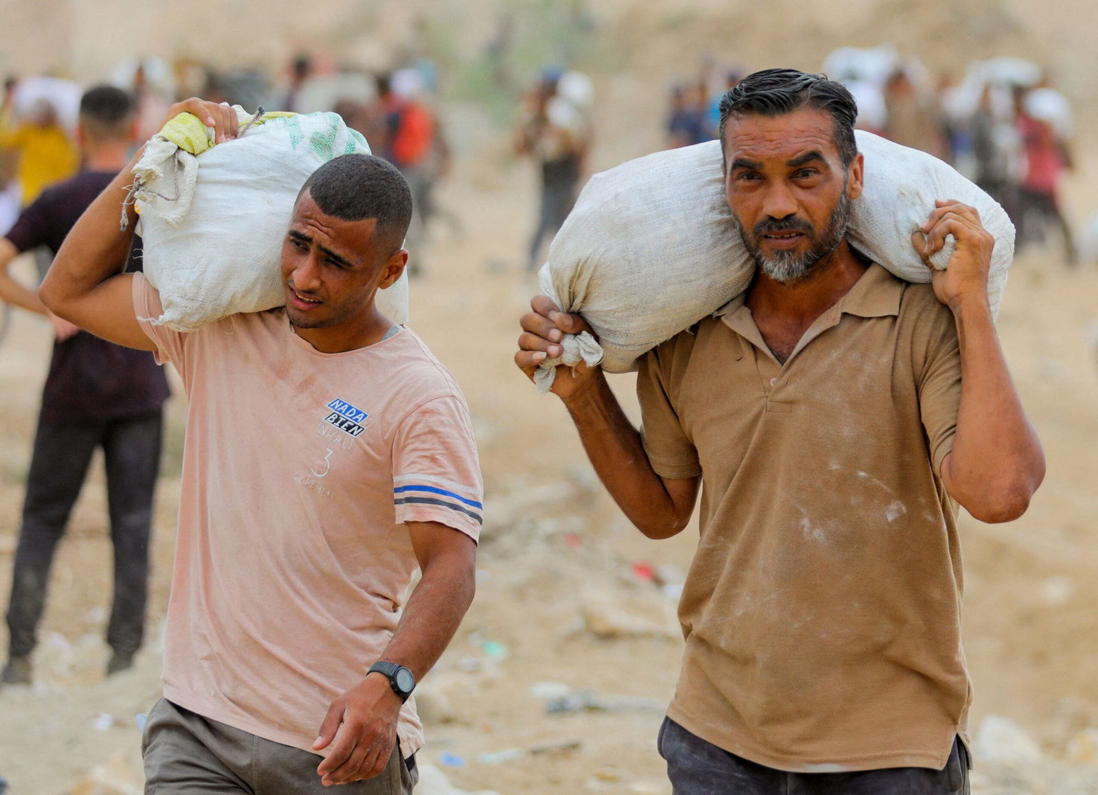 <i>Salah Malkawi/Getty Images via CNN Newsource</i><br/>A view from the air as Jordanian air force personnel perform an air drop of aid and humanitarian supplies in Gaza on August 6.