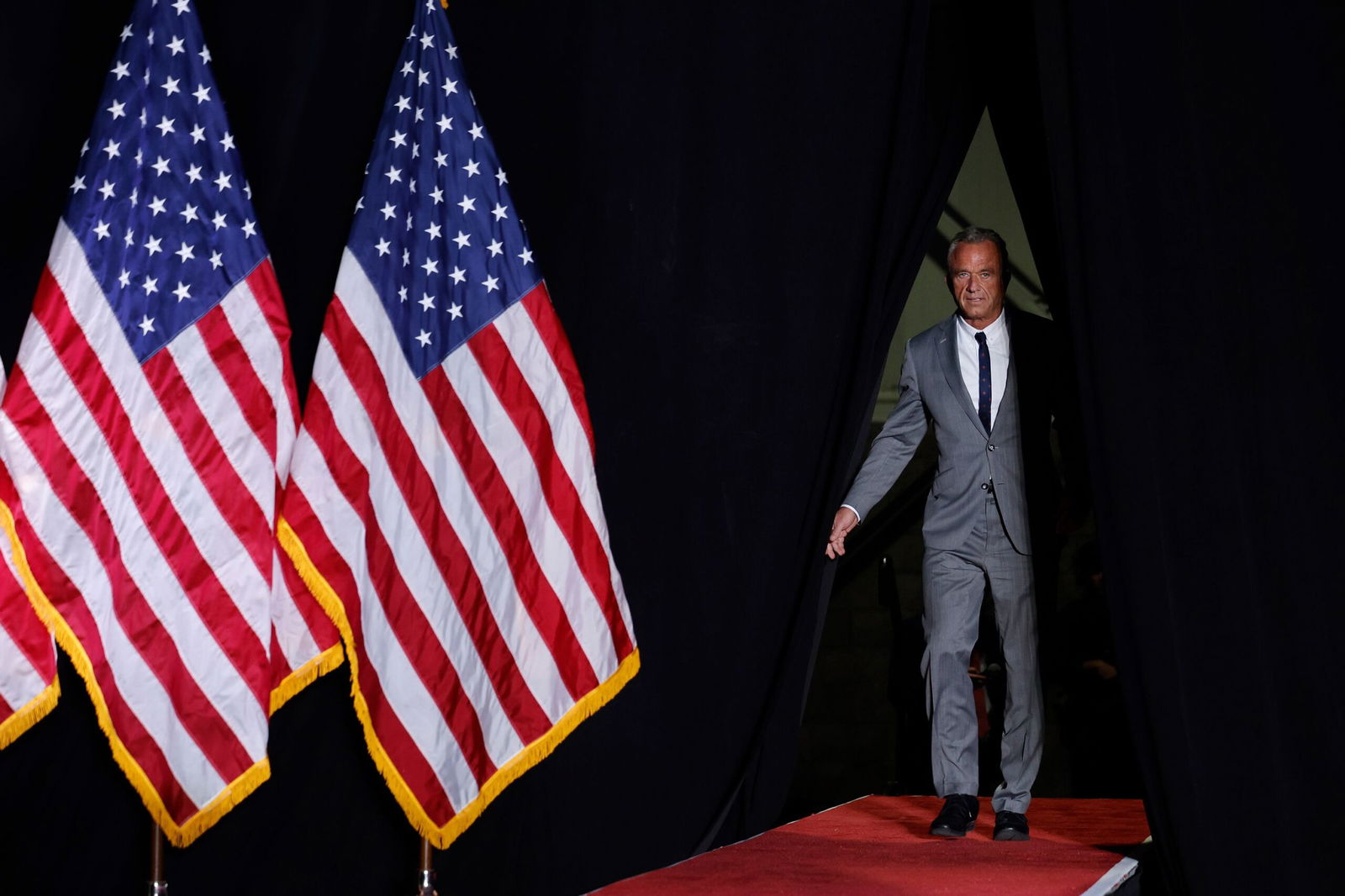 <i>Chip Somodevilla/Getty Images via CNN Newsource</i><br/>Robert F. Kennedy Jr. takes the stage during a campaign rally in Warren