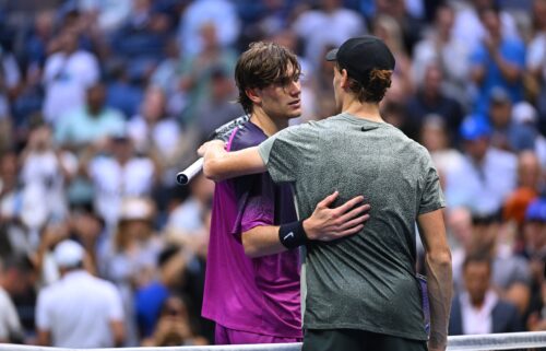 Jannik Sinner and Draper (in purple) at the end of their semifinal at the 2024 US Open.