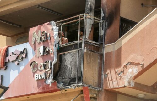 People look at the damage to Nasser Medical Complex in Khan Younis