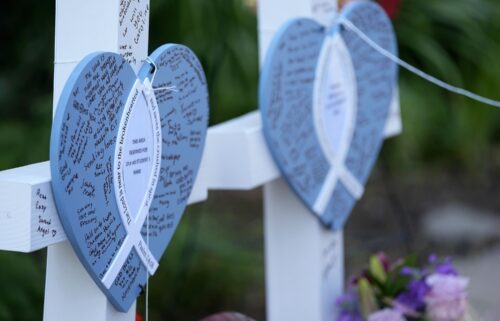 Written messages are left on hearts at a makeshift memorial at Annunciation Catholic Church and School in Minneapolis on Thursday.