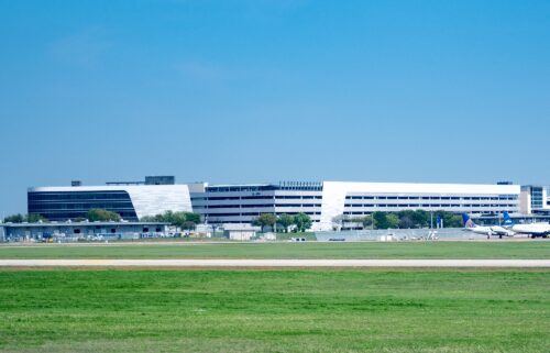 Aircraft park near terminal buildings in 2023 at Austin-Bergstrom International Airport in Texas.