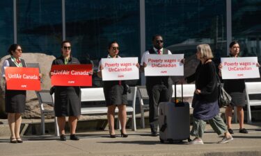 Air Canada flight attendants standing in a silent protest at Vancouver International Airport.