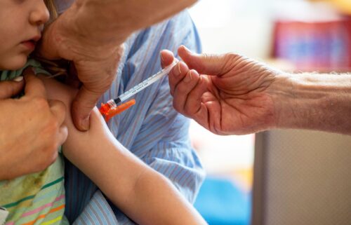 A young child receives a Moderna Covid-19 vaccine in Needham