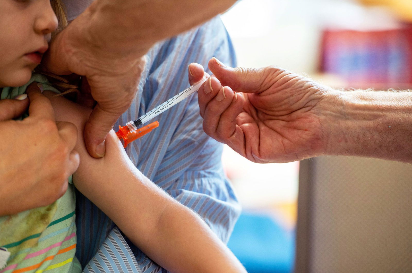 <i>Joseph Prezioso/AFP/Getty Images via CNN Newsource</i><br/>A young child receives a Moderna Covid-19 vaccine in Needham