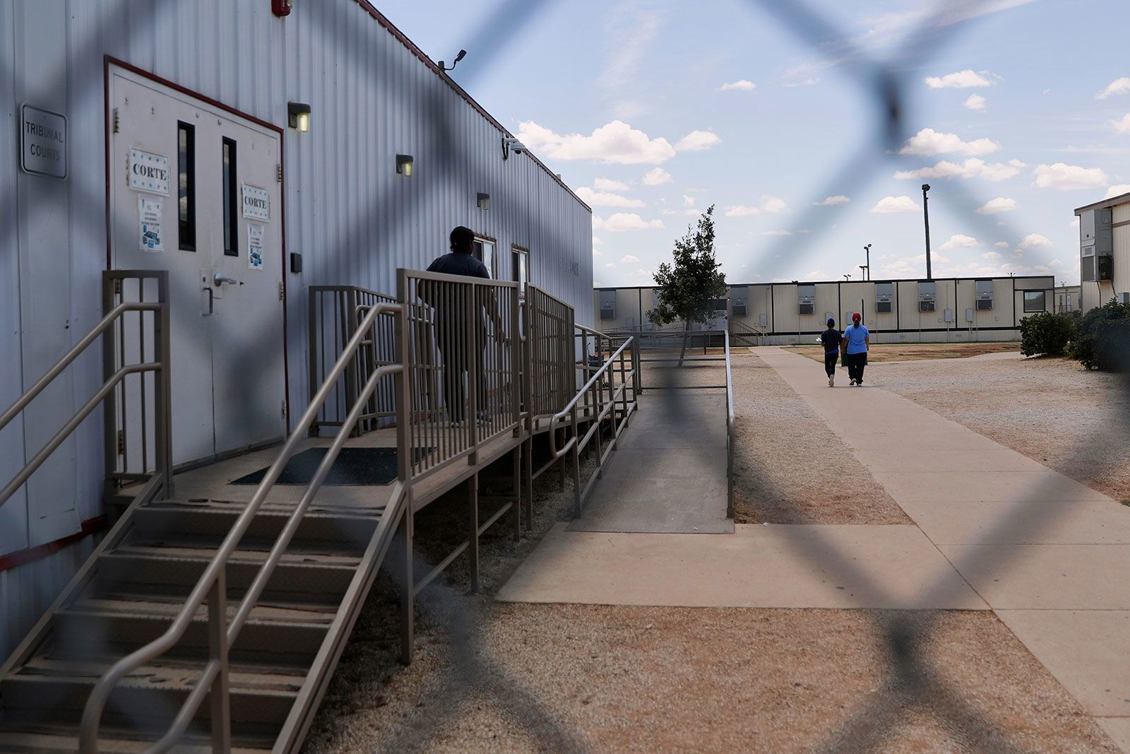 <i>Eric Gay/AP/File via CNN Newsource</i><br/>Immigrants walk through the ICE South Texas Family Residential Center