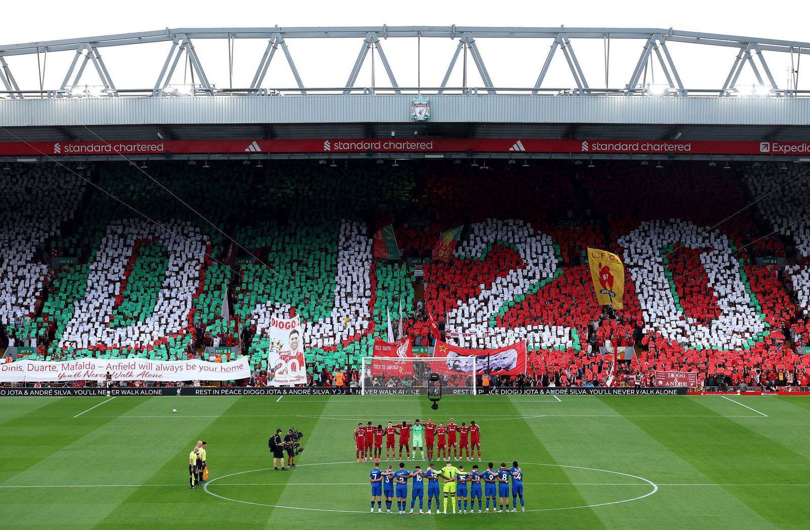 <i>Paul Ellis/AFP/Getty Images via CNN Newsource</i><br/>A memorial filled with flowers sits outside Anfield.