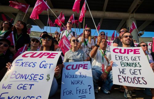 Air Canada flight attendants picket at Pearson International Airport in Toronto on Aug. 16.