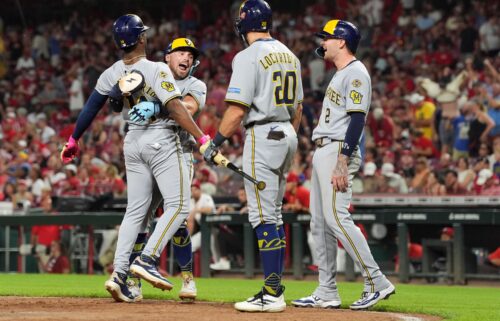 Milwaukee Brewers third baseman Caleb Durbin hits a double in the seventh inning against the Cincinnati Reds on August 16.