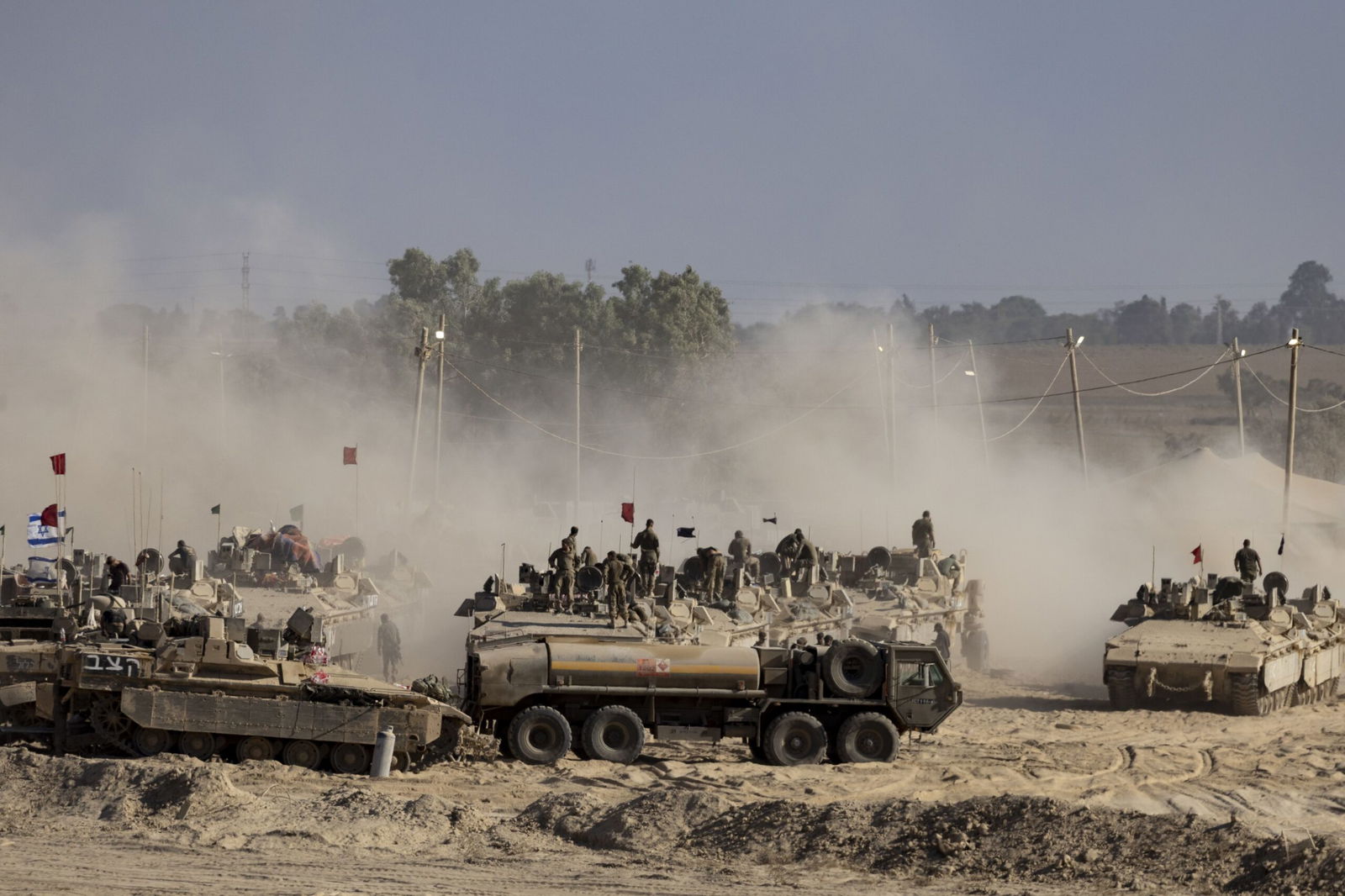 <i>Jack Guez/AFP/Getty Images via CNN Newsource</i><br/>Israeli army soldiers look at destroyed buildings in the Gaza Strip as they stand on the border with the Palestinian territory on Wednesday.