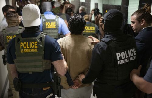 Federal agents detain a person after attending a court hearing at immigration court at the Jacob K. Javitz Federal Building on July 1 in New York City