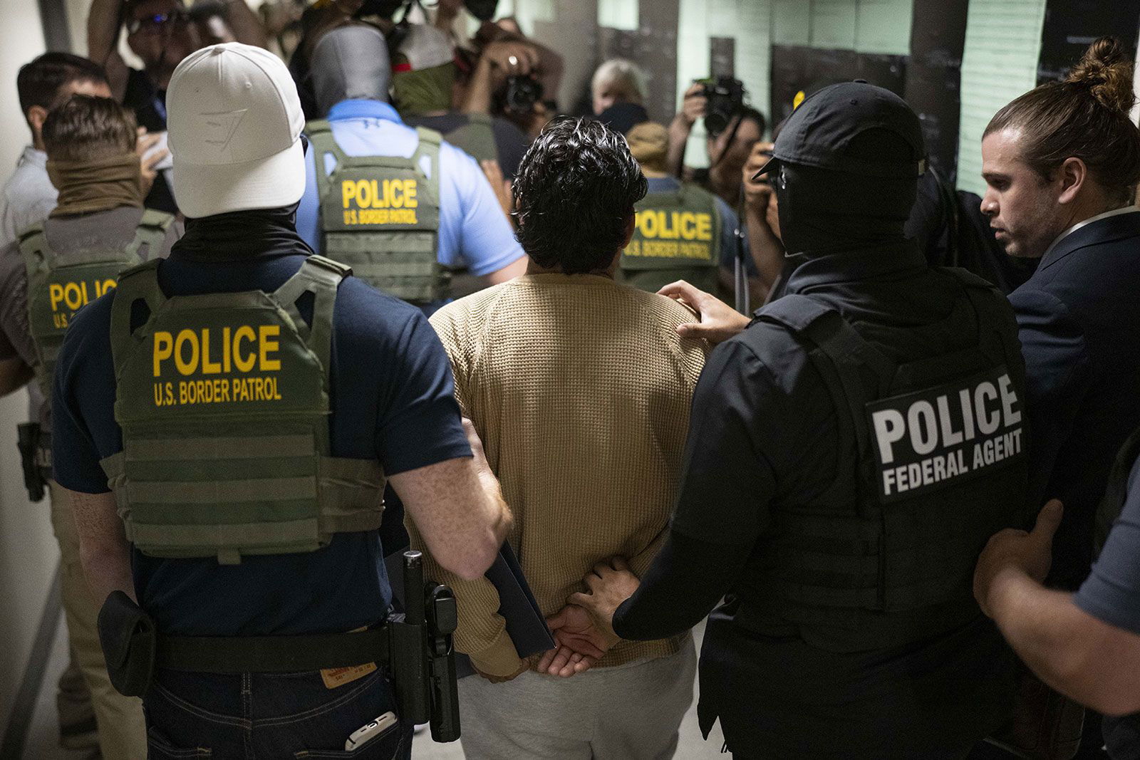 <i>Mostafa Bassim/Anadolu/Getty Images via CNN Newsource</i><br/>Federal agents detain a person after attending a court hearing at immigration court at the Jacob K. Javitz Federal Building on July 1 in New York City