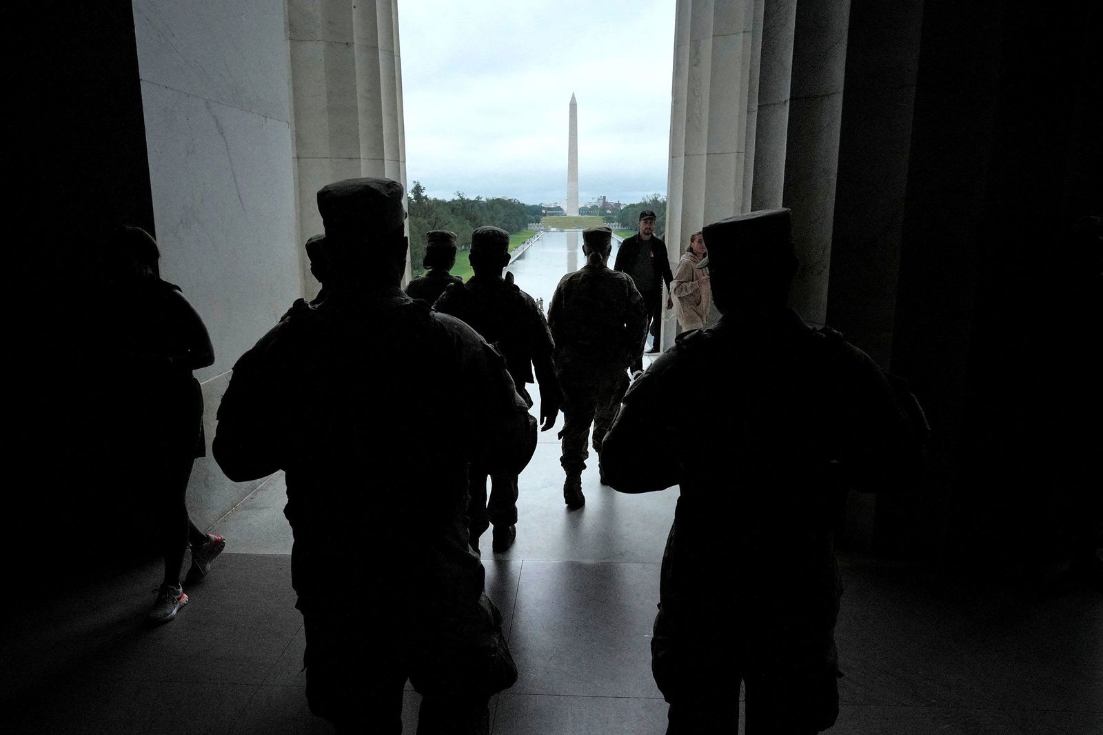 <i>Ken Cedeno/Reuters via CNN Newsource</i><br/>Members of the National Guard patrol the Lincoln Memorial in Washington