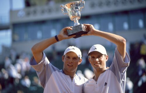 Michael Bryan and Bob Bryan lift the trophy after their win in the men's doubles final of the French Open in 2003.