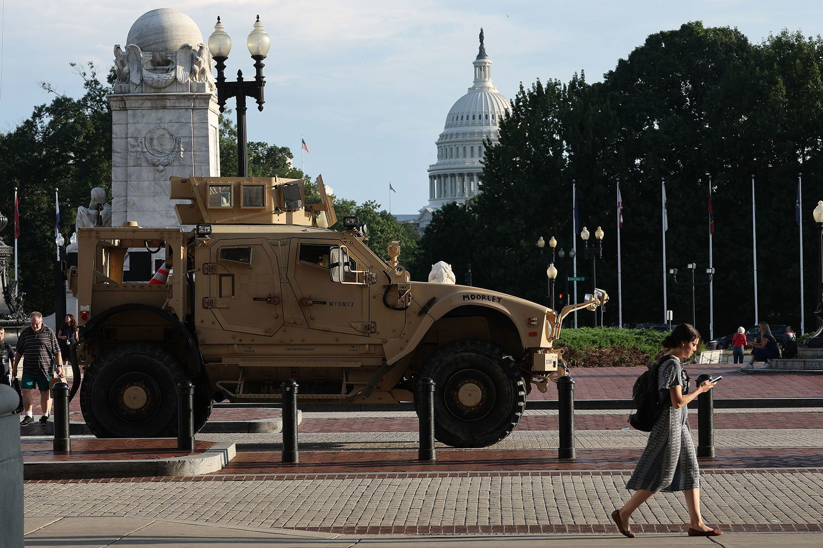 <i>Julia Demaree Nikhinson/AP via CNN Newsource</i><br/>A member of the DC National Guard patrols along the National Mall on August 16