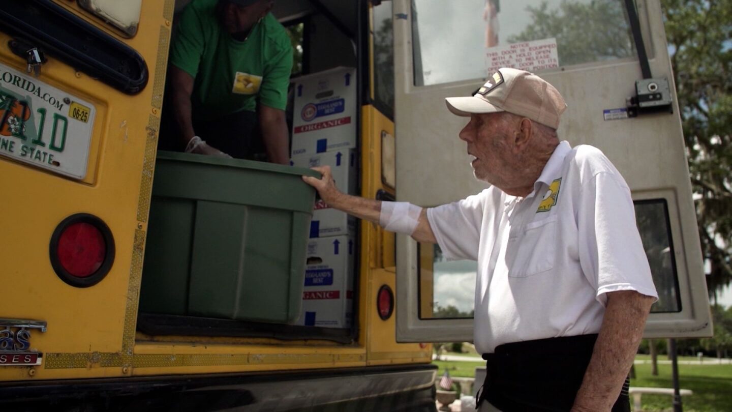 <i>CNN via CNN Newsource</i><br/>Bill Brown helps with a food delivery along the Children's Table weekly bus route.