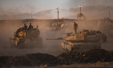 Israeli soldiers prepare tanks on August 18 near the Gaza Strip's northern border.