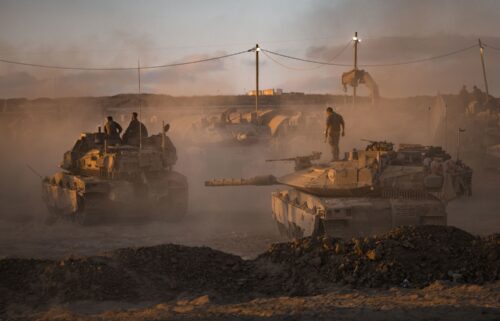 Israeli soldiers prepare tanks on August 18 near the Gaza Strip's northern border.