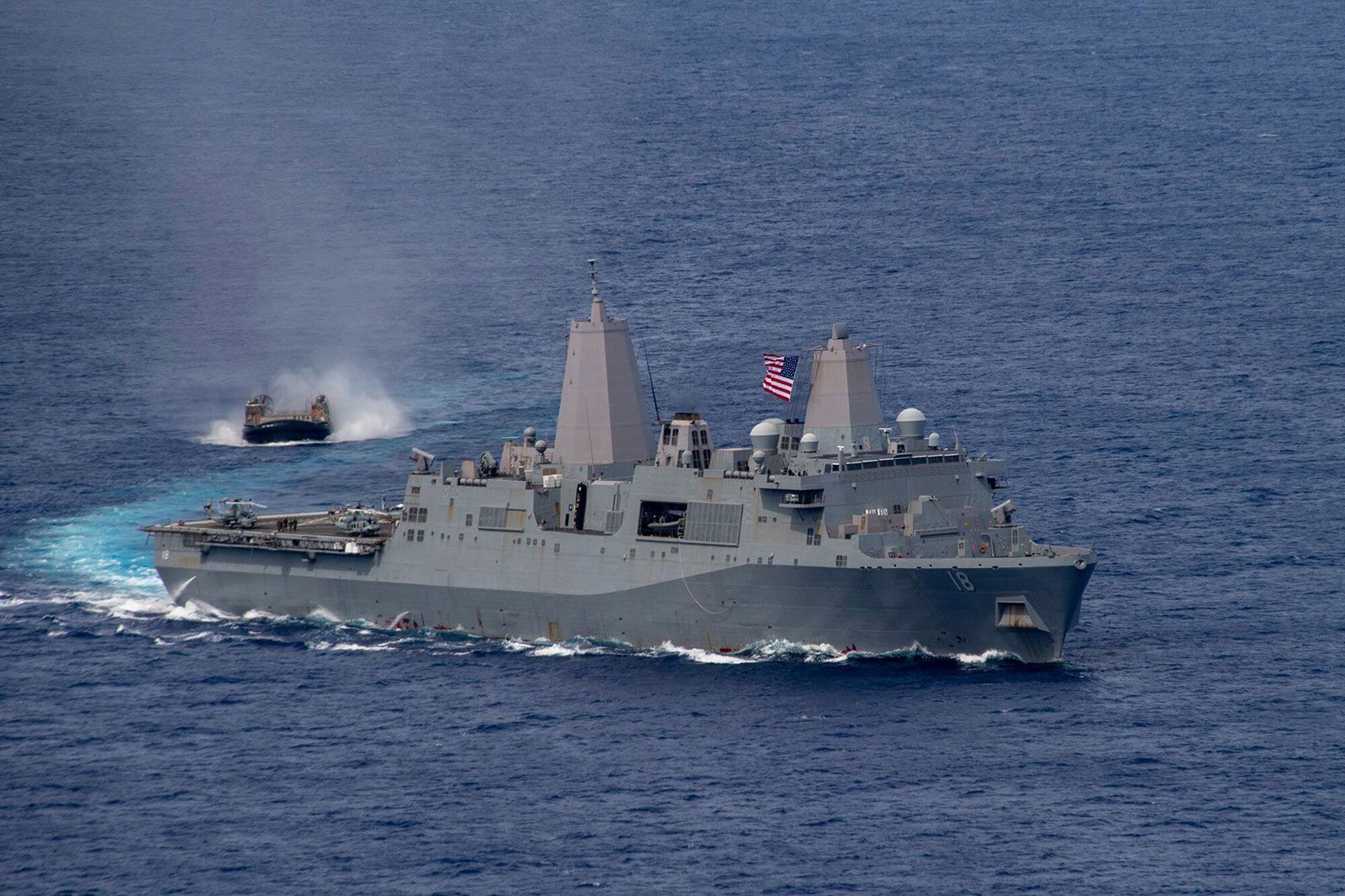 <i>Jomark Almazan/US Navy via CNN Newsource</i><br/>Amphibious transport dock USS New Orleans sails alongside a Japan Maritime Self Defense Force landing craft in June 2021.