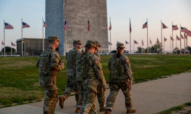 Members of the National Guard patrol the Washington Monument on August 16 in Washington