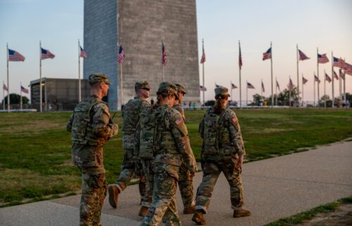 Members of the National Guard patrol the Washington Monument on August 16 in Washington