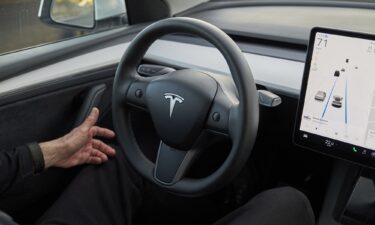 A Tesla Model Y equipped with Tesla's "Autopilot" feature. Federal safety regulators are looking at whether or not Tesla is complying with rules to promptly report accidents involving its autonomous driving technology.