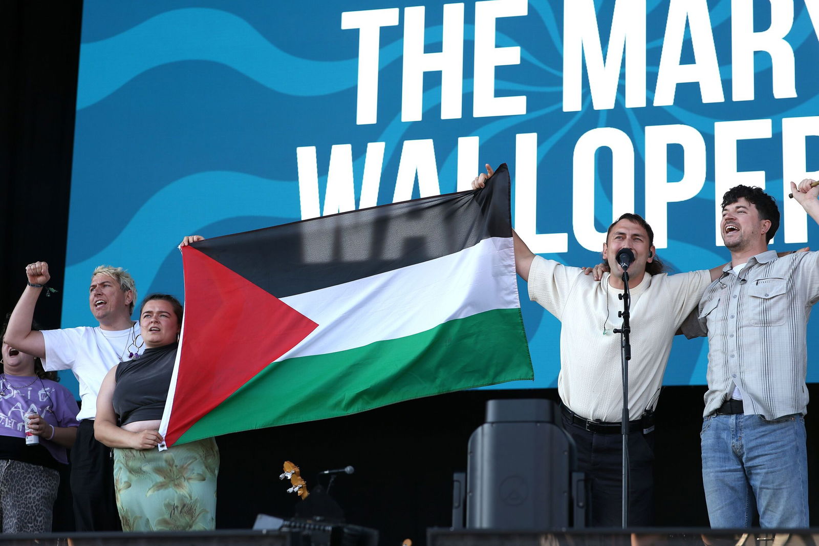 <i>Harry Herd/WireImage/Getty Images via CNN Newsource</i><br/>The Mary Wallopers demonstrate onstage during Day 1 of Victorious Festival on August 22