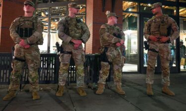Members of the Ohio National Guard wear their sidearms while patrolling in the Logan Circle neighborhood